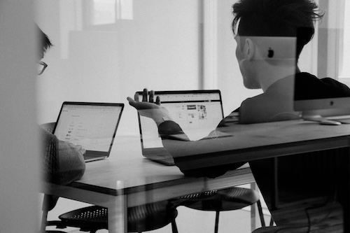 2 men on their laptops